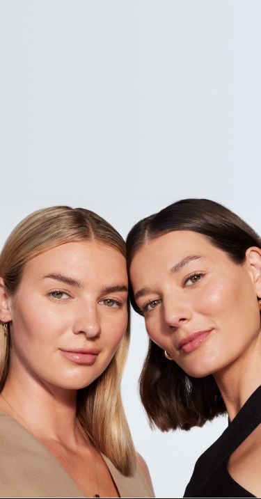 Two female JUVÉDERM patients posing.